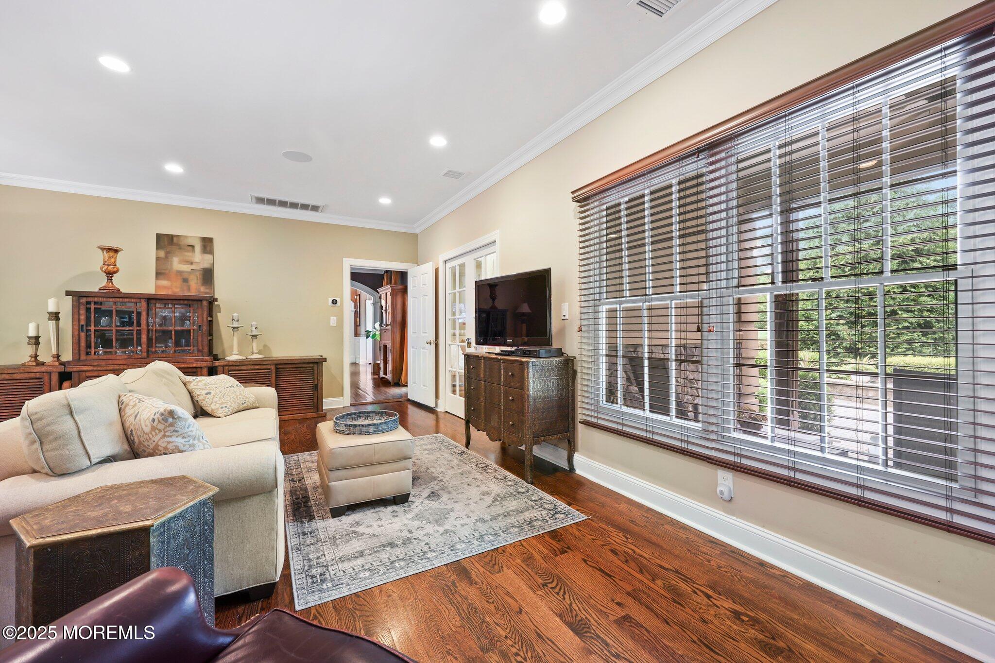 4 White Pines Way Freehold, NJ 07728 - Photo 49 of 66 a living room with furniture and a flat screen tv
