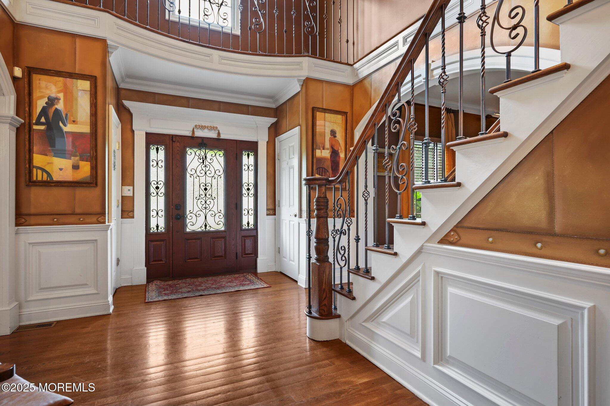 4 White Pines Way Freehold, NJ 07728 - Photo 9 of 66 a view of an entryway with wooden floor and door