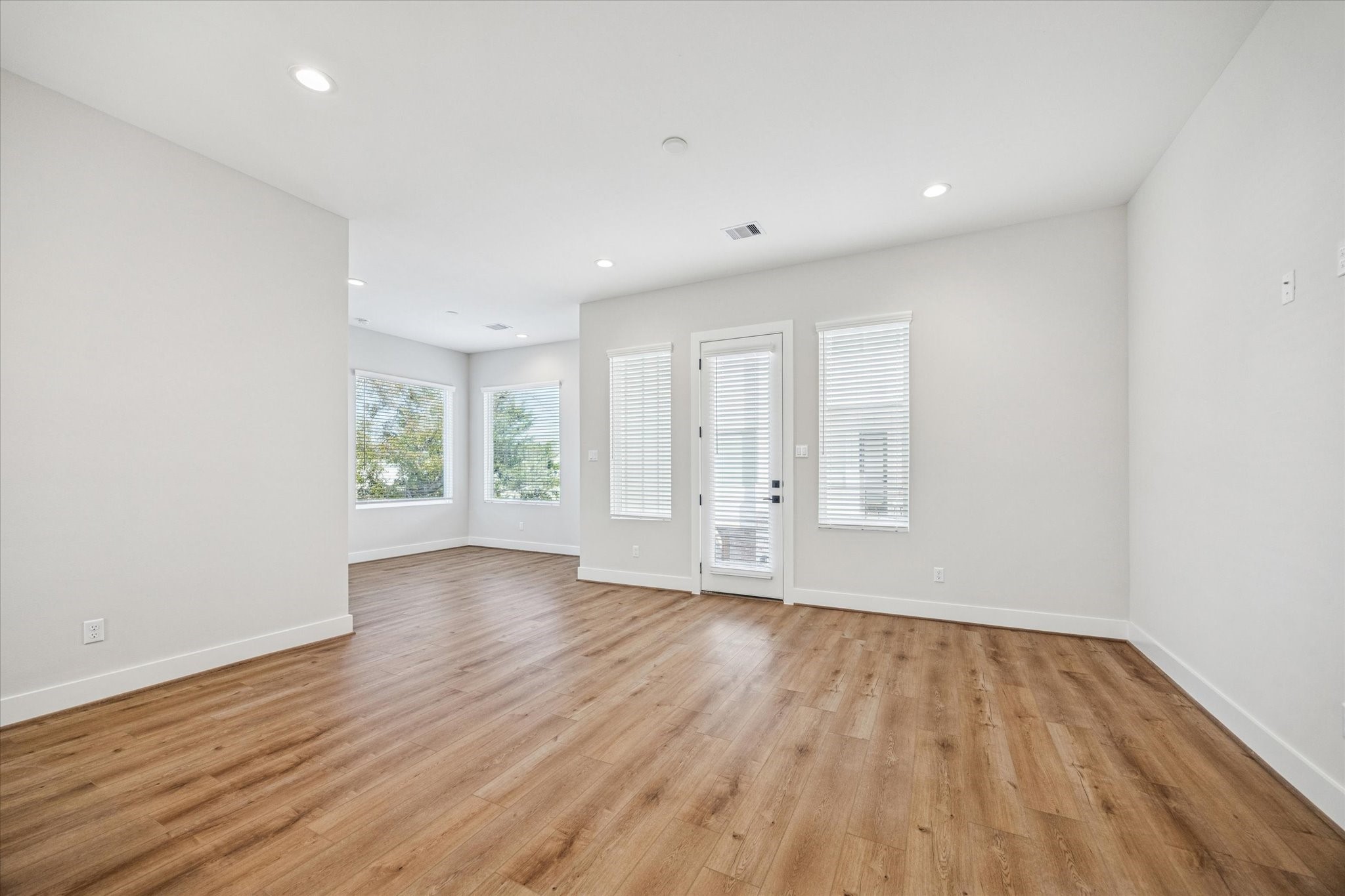 520 Janisch Road Houston, TX 77018 - Photo 11 of 28 The living room has direct access to the balcony, creating a seamless indoor/ outdoor space perfect for entertaining.