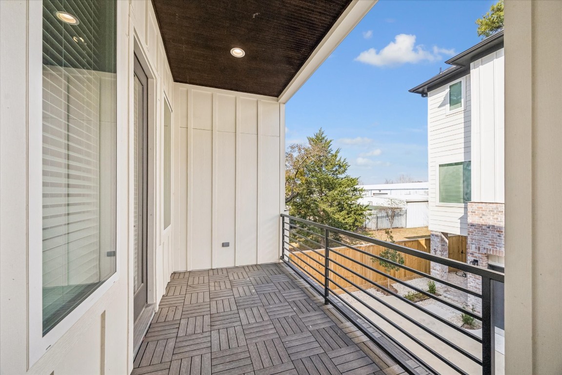 520 Janisch Road Houston, TX 77018 - Photo 13 of 28 An oversized balcony provides plenty of room for dining or lounging, inviting you to unwind and enjoy the outdoors.