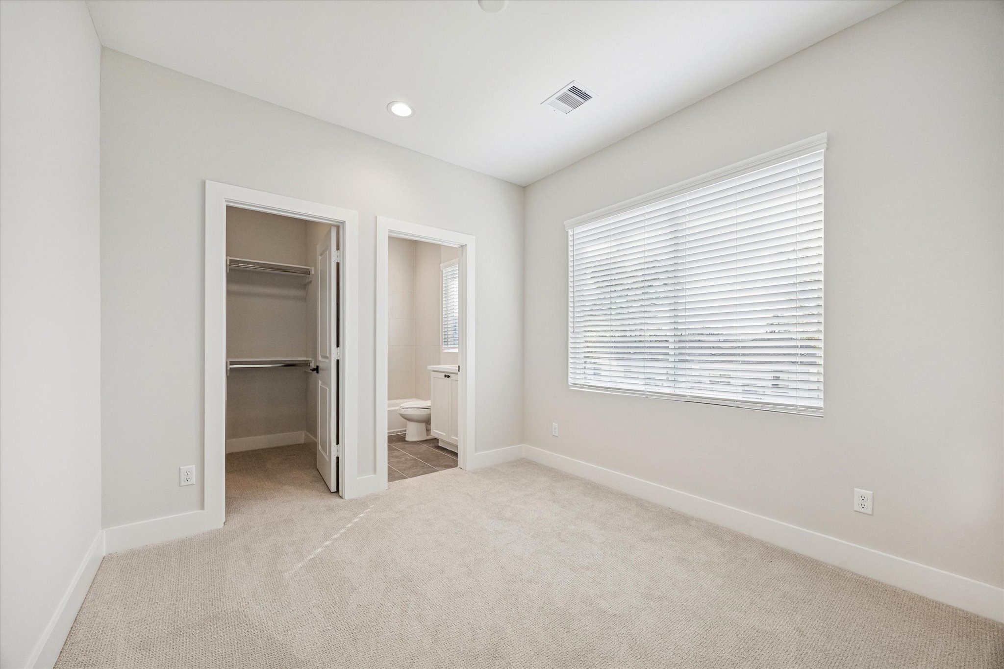 520 Janisch Road Houston, TX 77018 - Photo 17 of 28 Second bedroom on the third floor features recessed lighting, large windows, an ensuite bathroom and a walk-in closet.