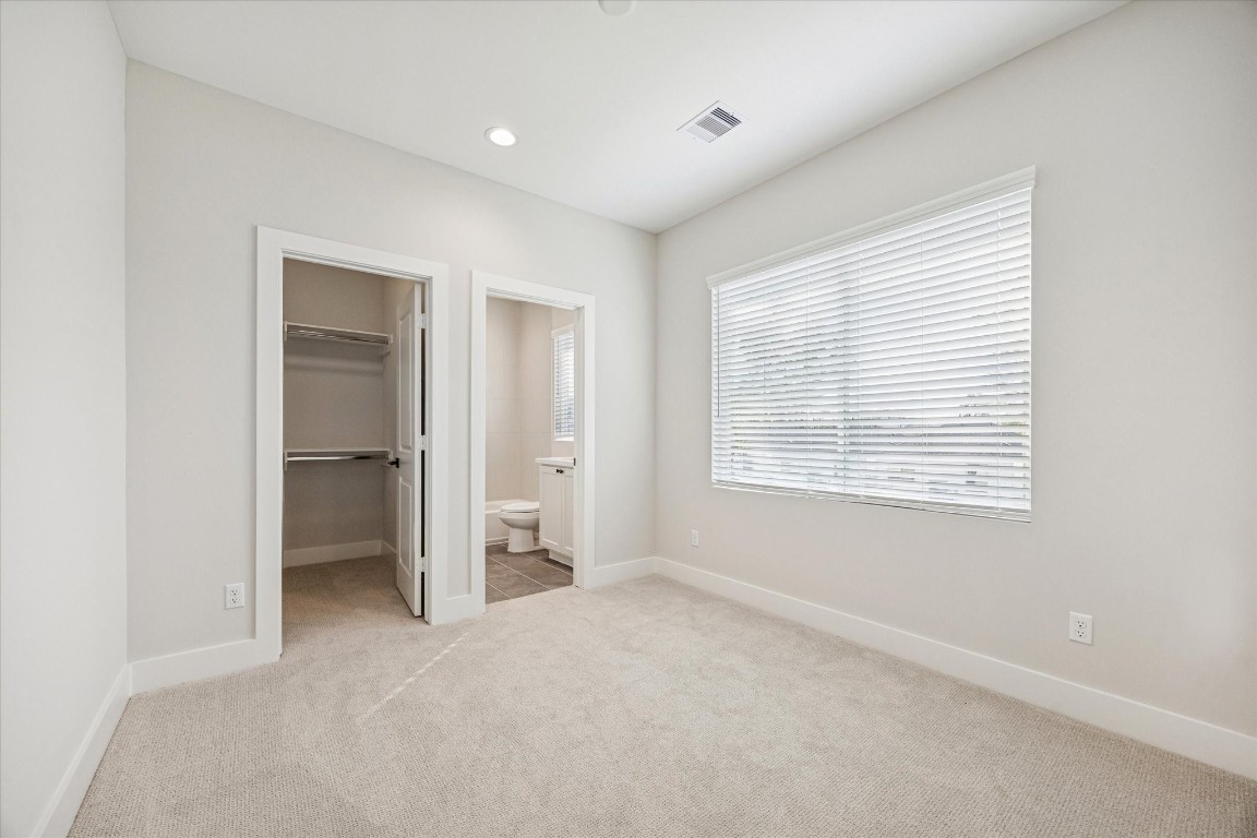 520 Janisch Road Houston, TX 77018 - Photo 17 of 28 Second bedroom on the third floor features recessed lighting, large windows, an ensuite bathroom and a walk-in closet.