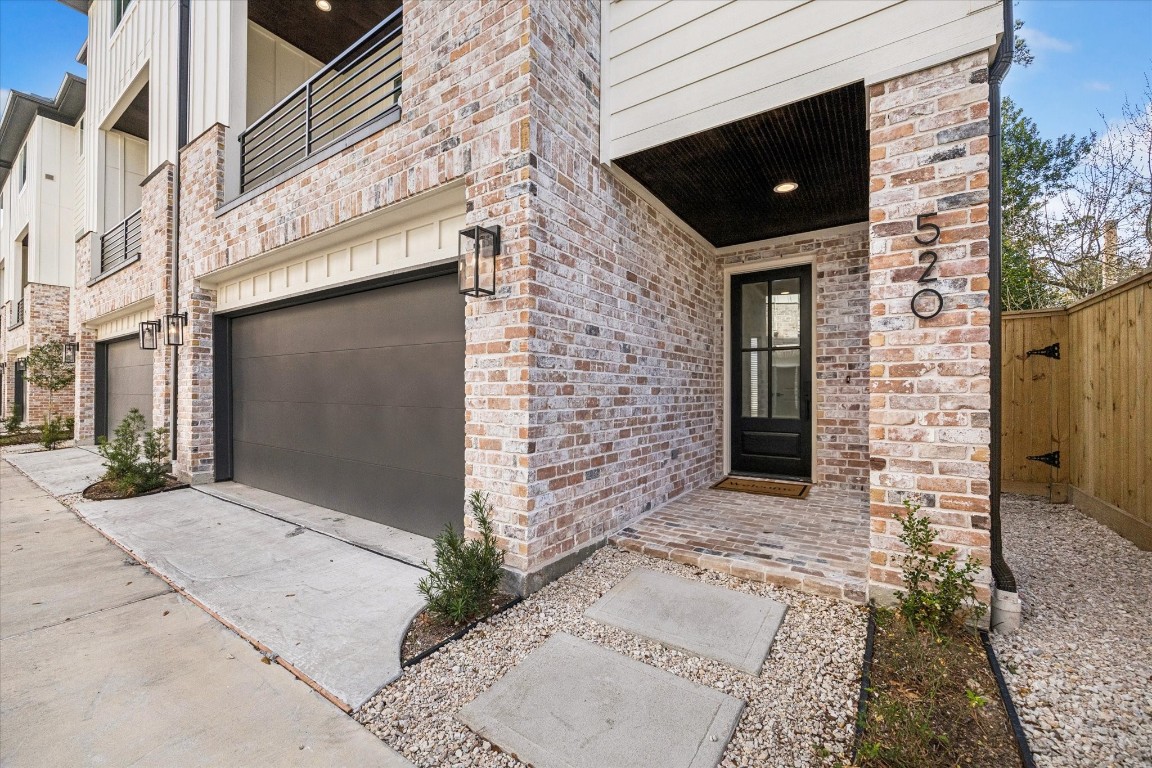 520 Janisch Road Houston, TX 77018 - Photo 26 of 28 A charming covered front porch paired with a stylish front door welcomes guests in style.