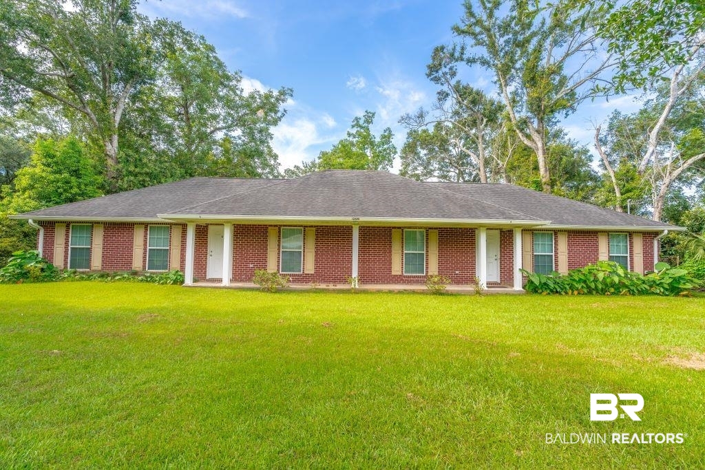 12641 Pecan Street Grand Bay, AL 36541 - Photo 1 of 23 Ranch-style house featuring a front lawn
