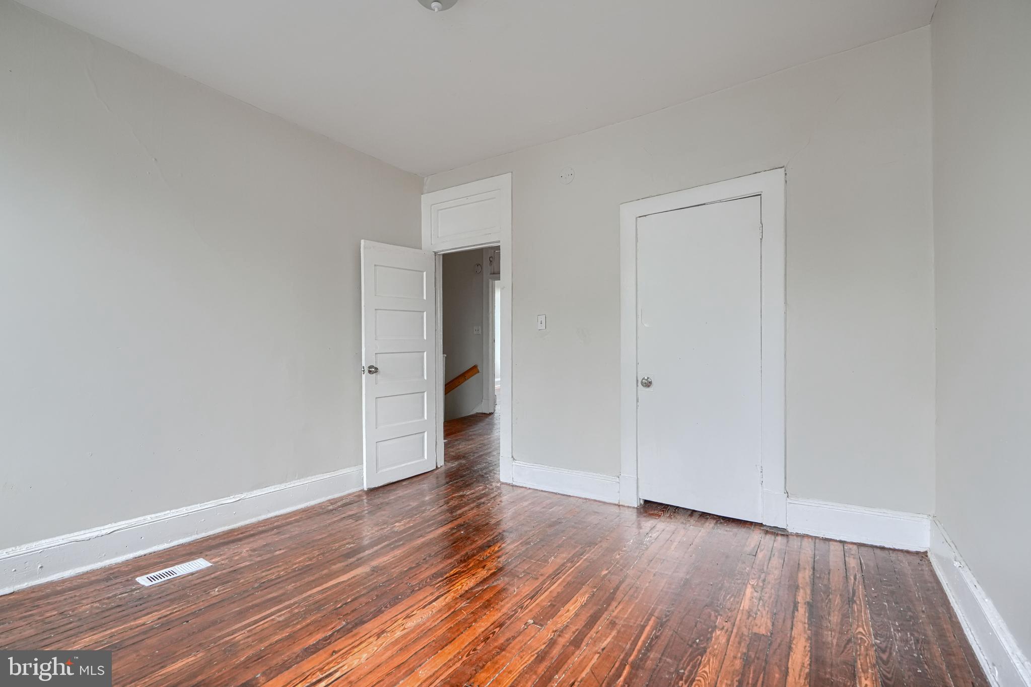4806 Reisterstown Road Baltimore, MD 21215 - Photo 21 of 34 a view of an empty room and wooden floor