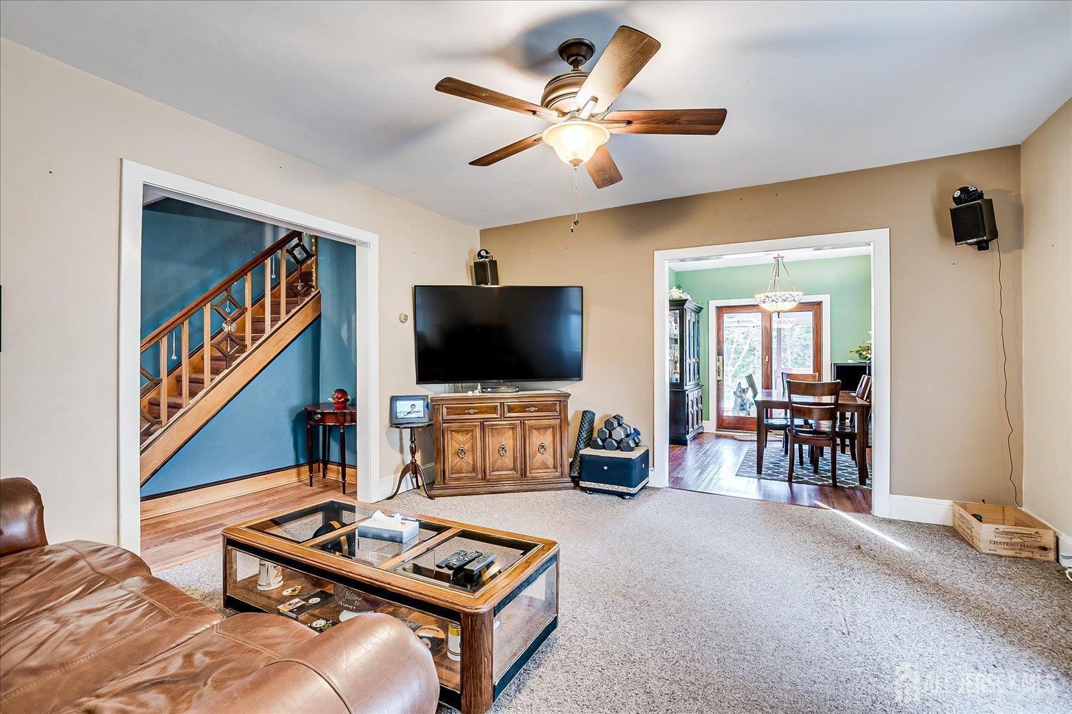61 Stouts Lane Monmouth Junction, NJ 08852 - Photo 11 of 42 a living room with furniture and a flat screen tv