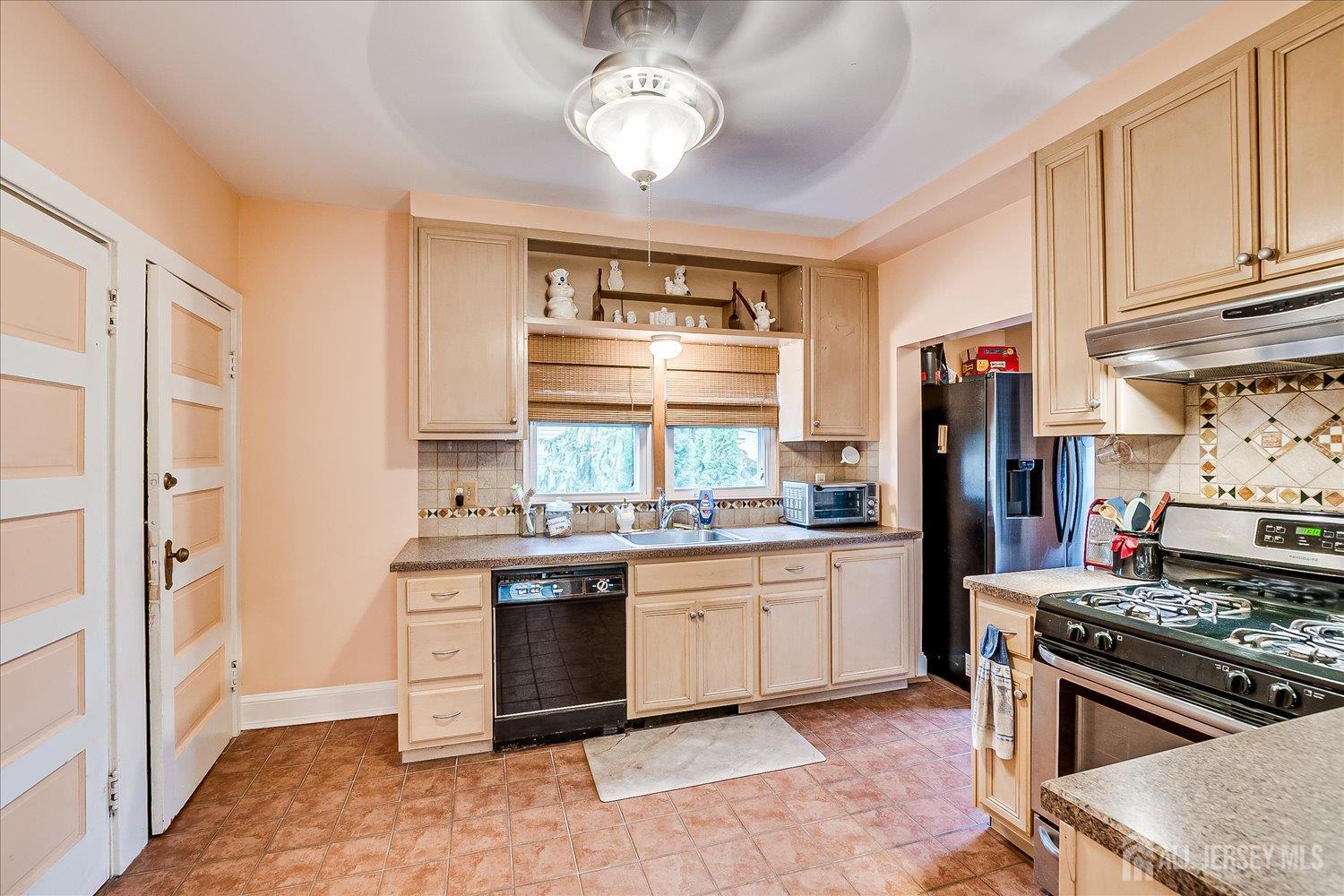 61 Stouts Lane Monmouth Junction, NJ 08852 - Photo 15 of 42 a kitchen with stainless steel appliances granite countertop a stove and a sink
