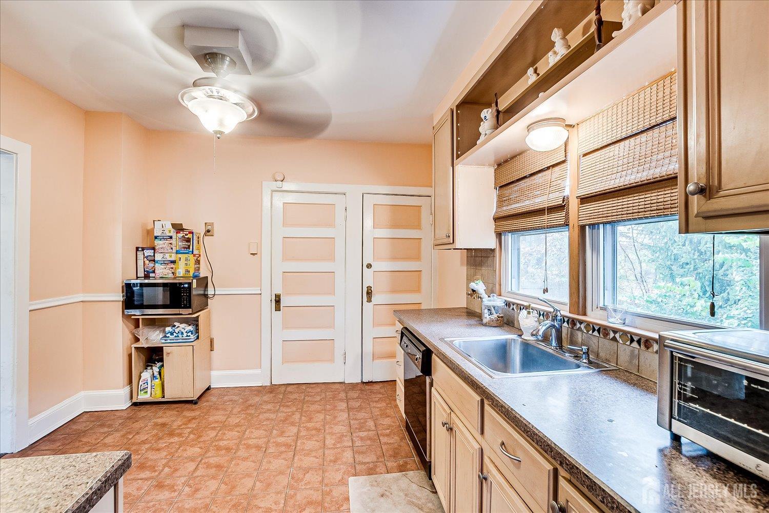 61 Stouts Lane Monmouth Junction, NJ 08852 - Photo 16 of 42 a kitchen with stainless steel appliances granite countertop a sink and stove