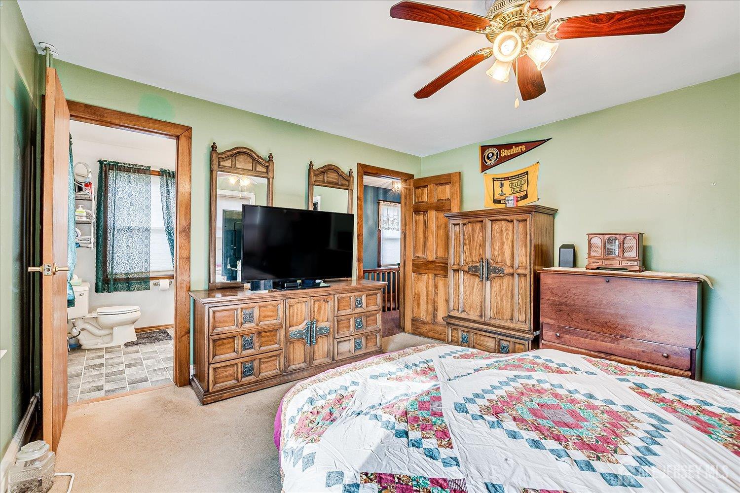 61 Stouts Lane Monmouth Junction, NJ 08852 - Photo 22 of 42 a bedroom with a bed and a flat screen tv