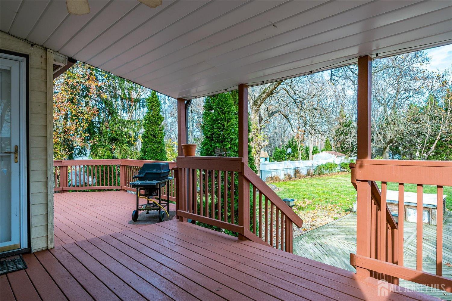 61 Stouts Lane Monmouth Junction, NJ 08852 - Photo 32 of 42 a view of a two chairs in the balcony next to a yard