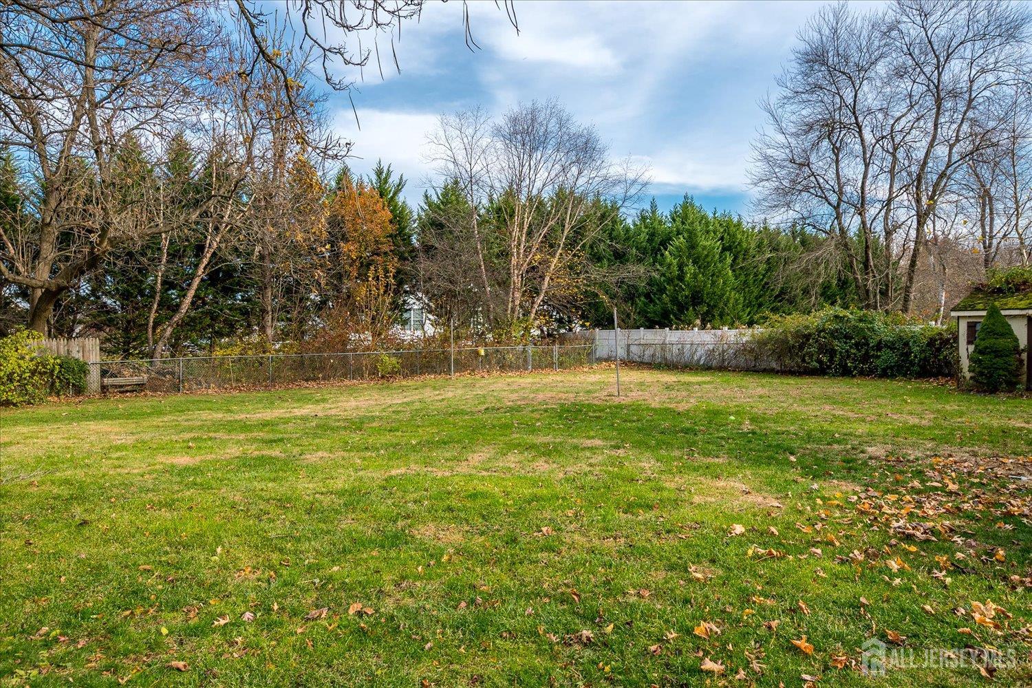 61 Stouts Lane Monmouth Junction, NJ 08852 - Photo 36 of 42 a view of outdoor space with deck and yard