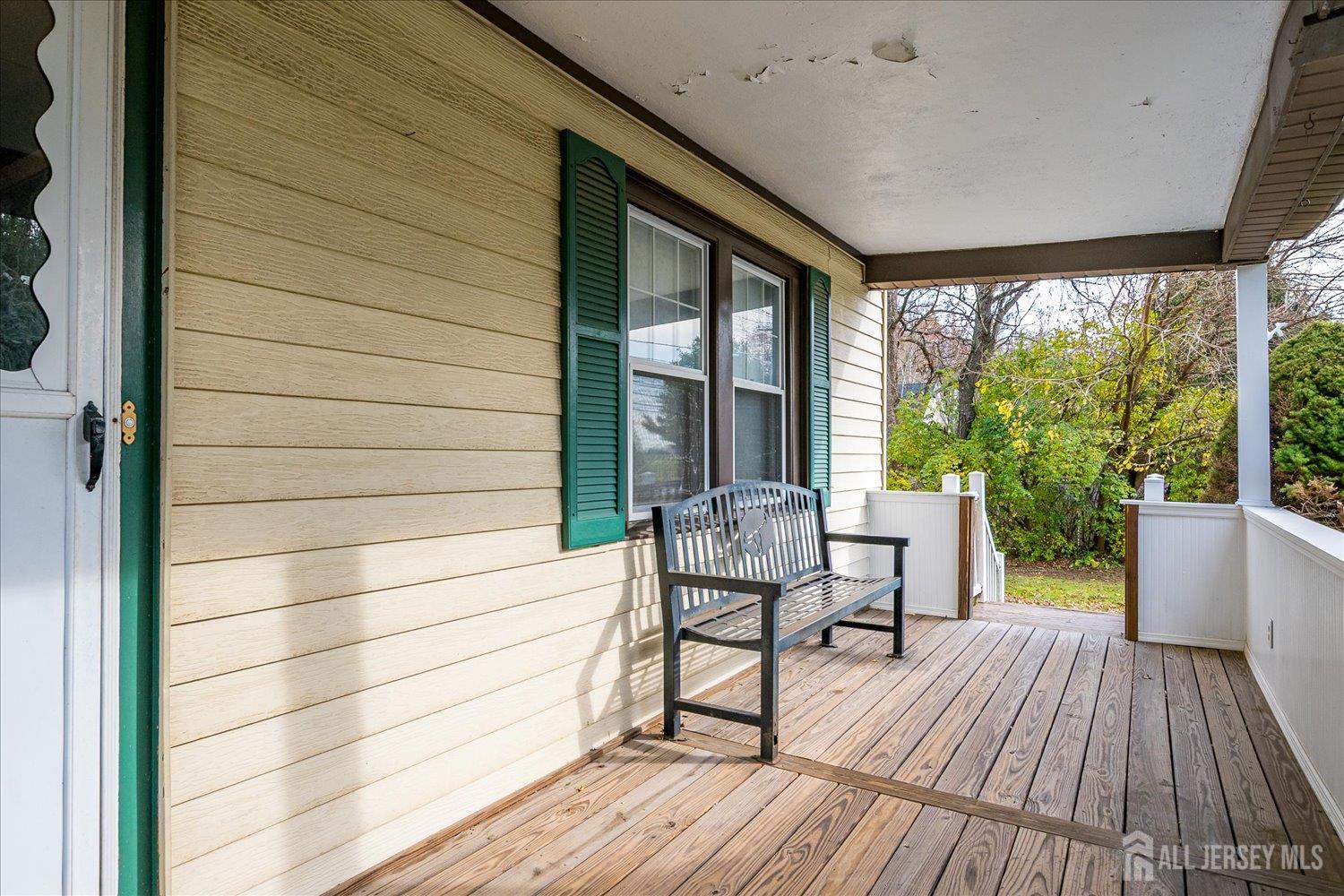61 Stouts Lane Monmouth Junction, NJ 08852 - Photo 8 of 42 a view of chair in wooden deck