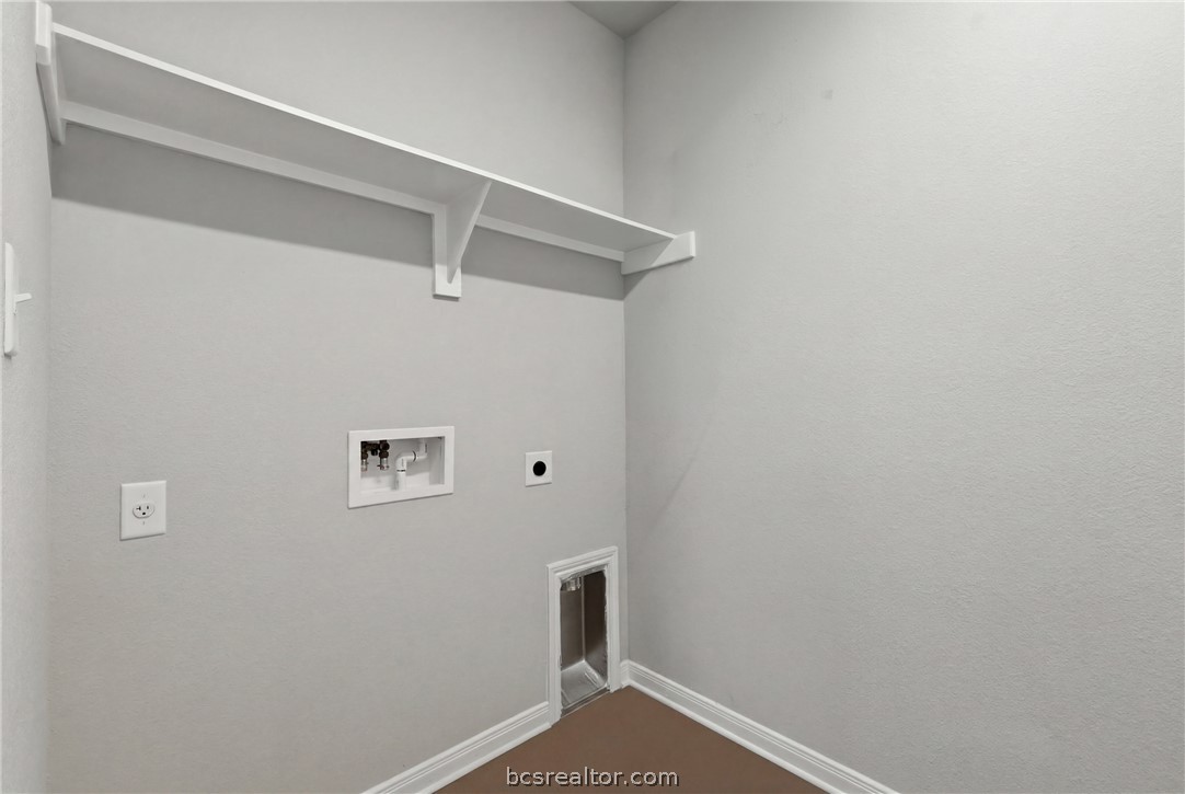 1922 Viva Road Bryan, TX 77807 - Photo 23 of 45 Convenient downstairs laundry room with washer/dryer connections and built-in hanging space.