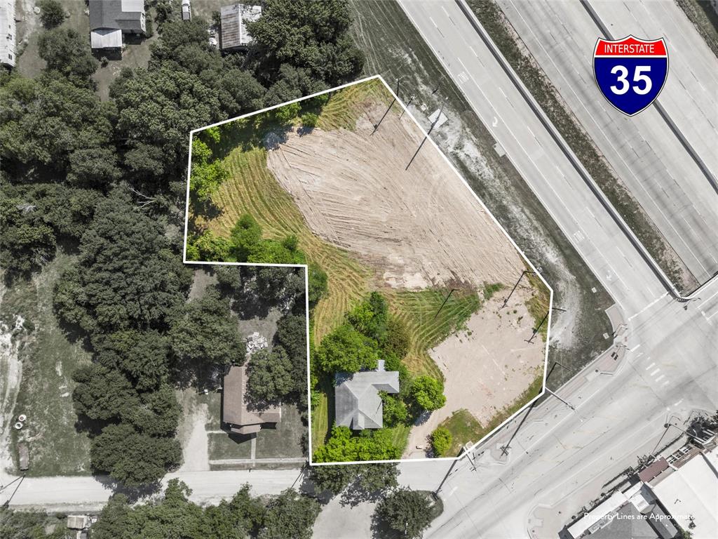 100 West 3rd Street Eddy, TX 76524 - Photo 1 of 14 a view of a back yard with street