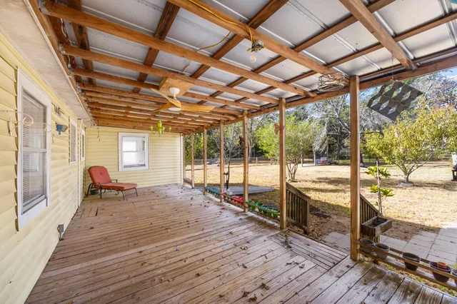 a view of a porch with wooden floor