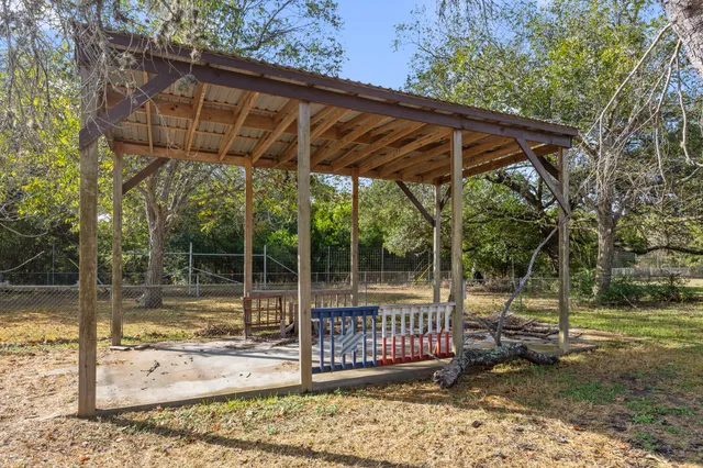 a view of a backyard with a small cabin