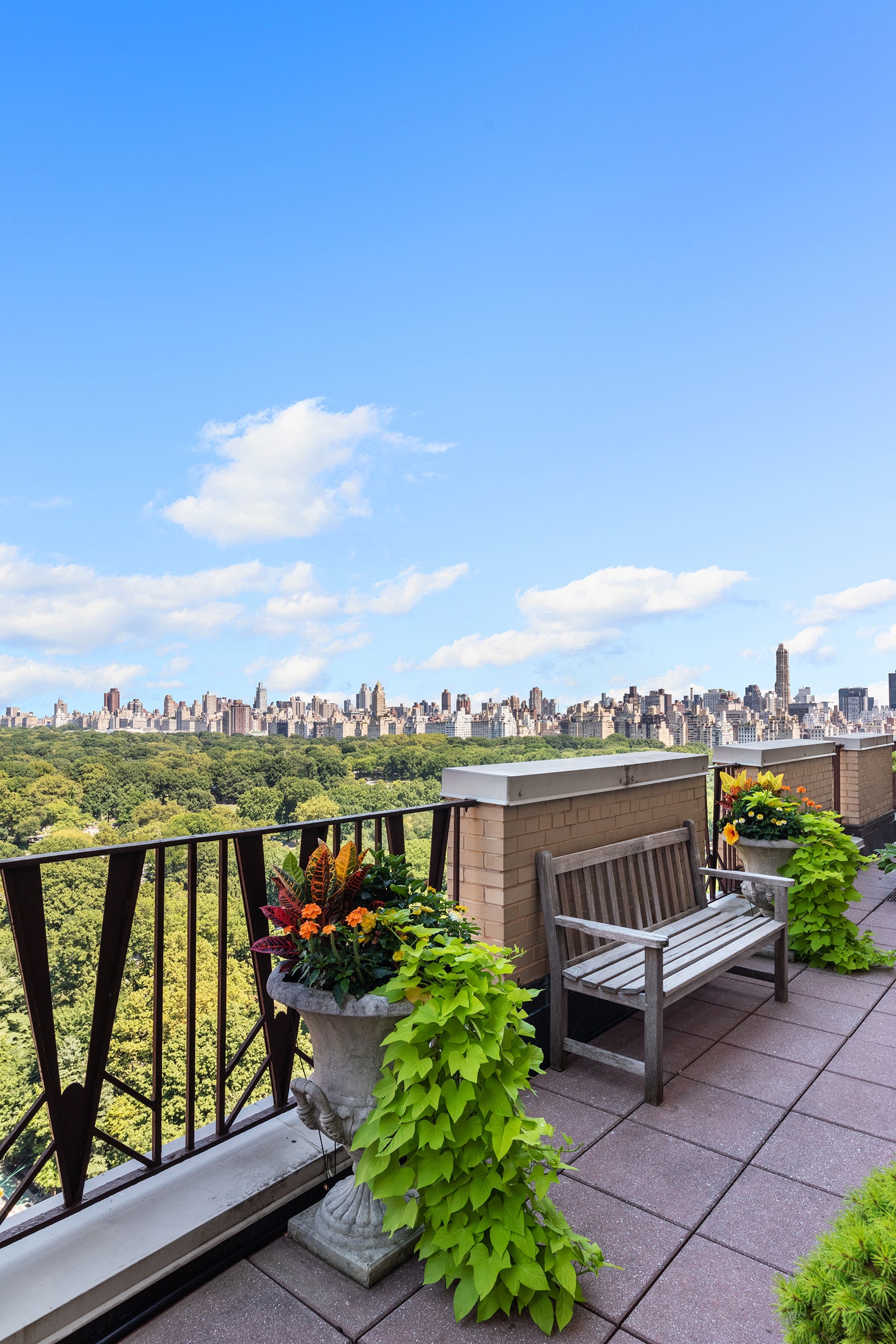 25 Central Park West, Unit 21Q Manhattan, NY 10023 - Photo 16 of 18 a view of a city with lawn chairs