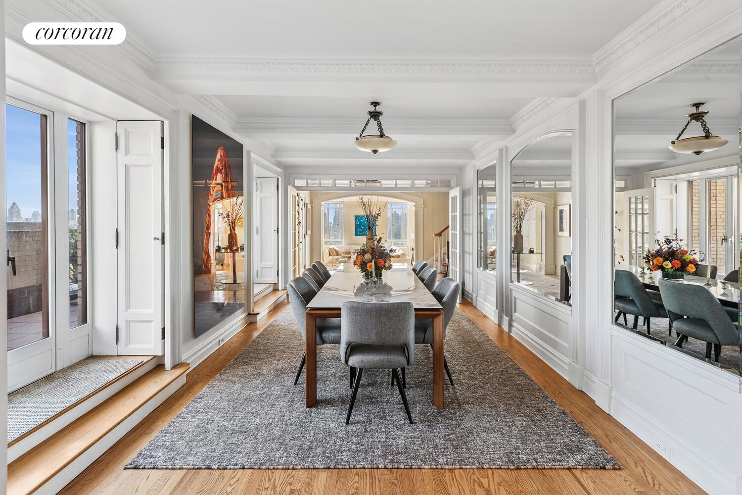 25 Central Park West, Unit 21Q Manhattan, NY 10023 - Photo 2 of 18 a dining room with wooden floor and large windows