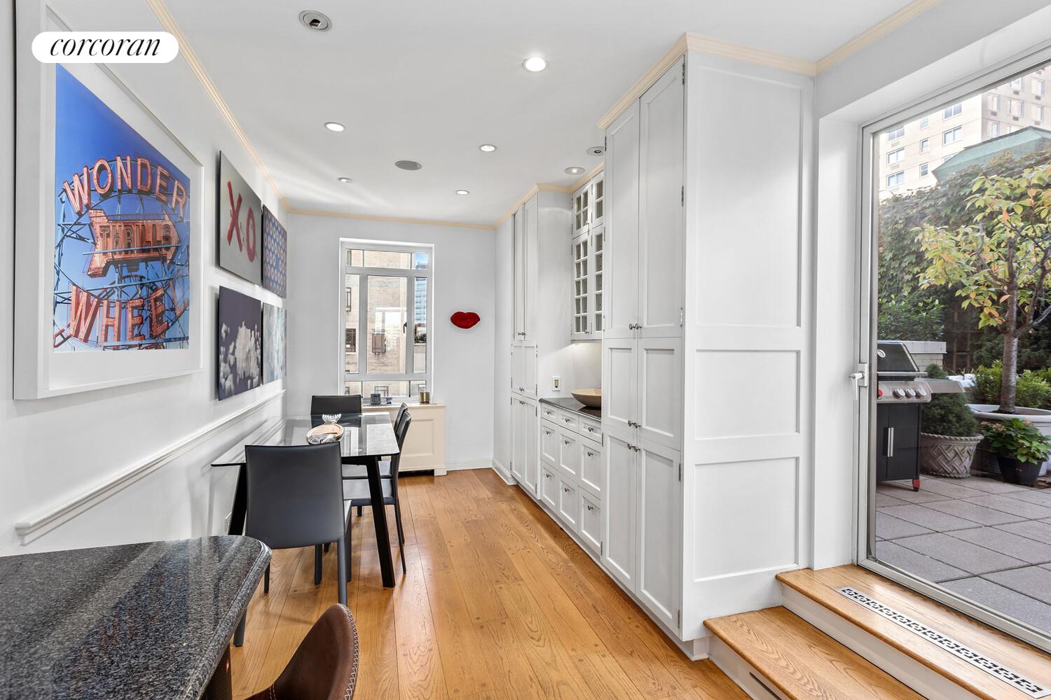 25 Central Park West, Unit 21Q Manhattan, NY 10023 - Photo 4 of 18 a view of kitchen with furniture and wooden floor