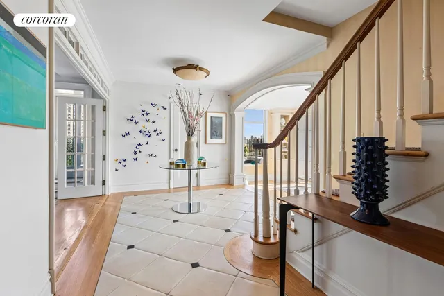 a view of an entryway with wooden floor