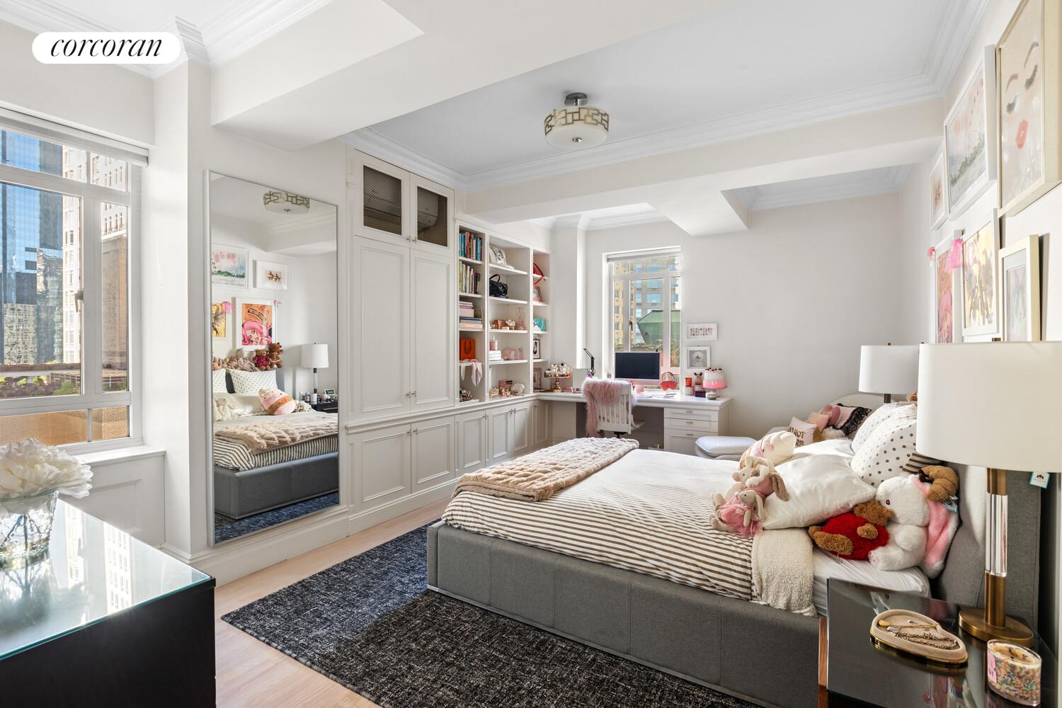 25 Central Park West, Unit 21Q Manhattan, NY 10023 - Photo 7 of 18 a bedroom with a bed and a couch