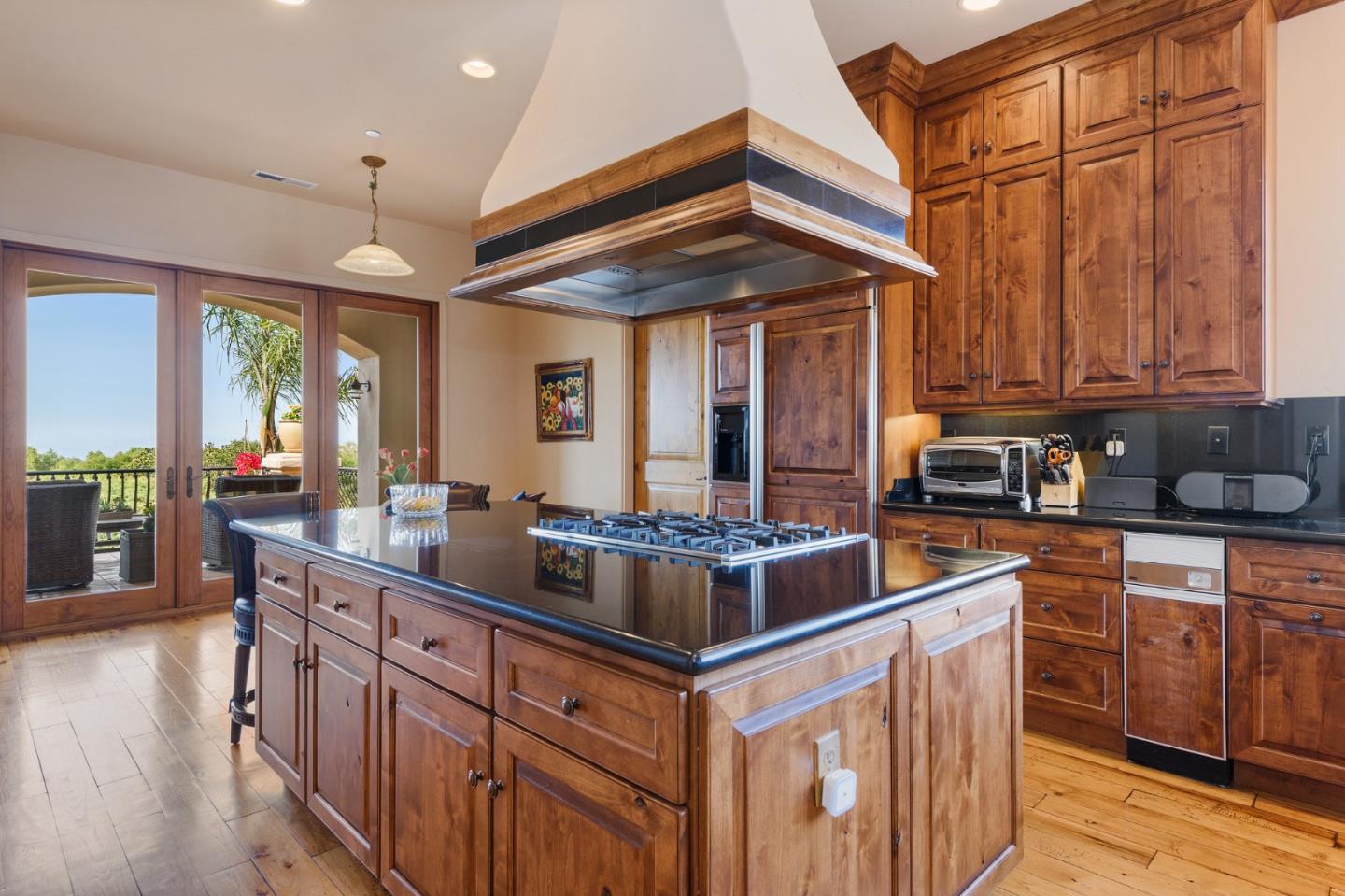 11550 Spur Road Monterey, CA 93940 - Photo 20 of 66 a kitchen with stainless steel appliances granite countertop a stove and a wooden cabinets