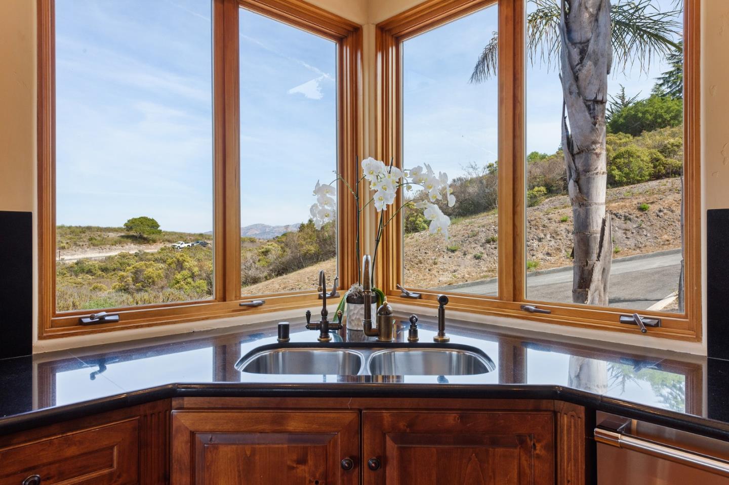 11550 Spur Road Monterey, CA 93940 - Photo 23 of 66 a kitchen with granite countertop a sink and a window