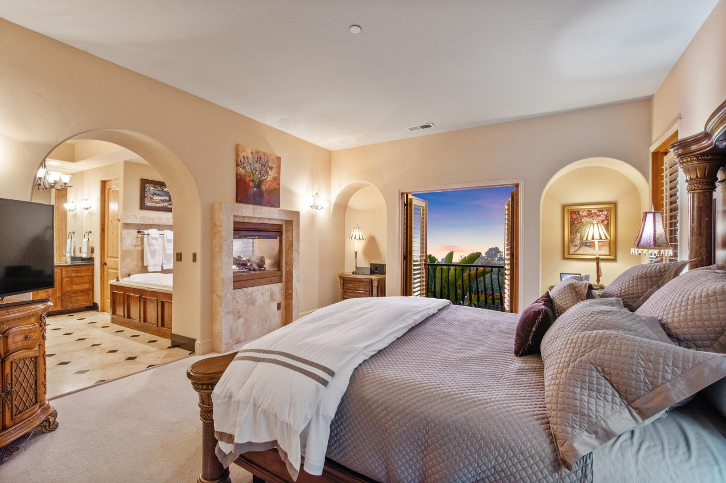 11550 Spur Road Monterey, CA 93940 - Photo 30 of 66 a spacious bedroom with a bed a mirror on dresser and a flat screen tv