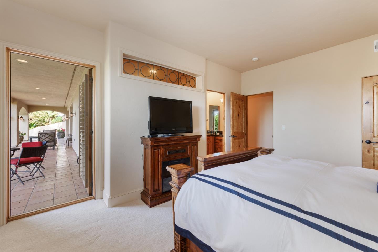 11550 Spur Road Monterey, CA 93940 - Photo 56 of 66 a bedroom with a bed and a flat screen tv