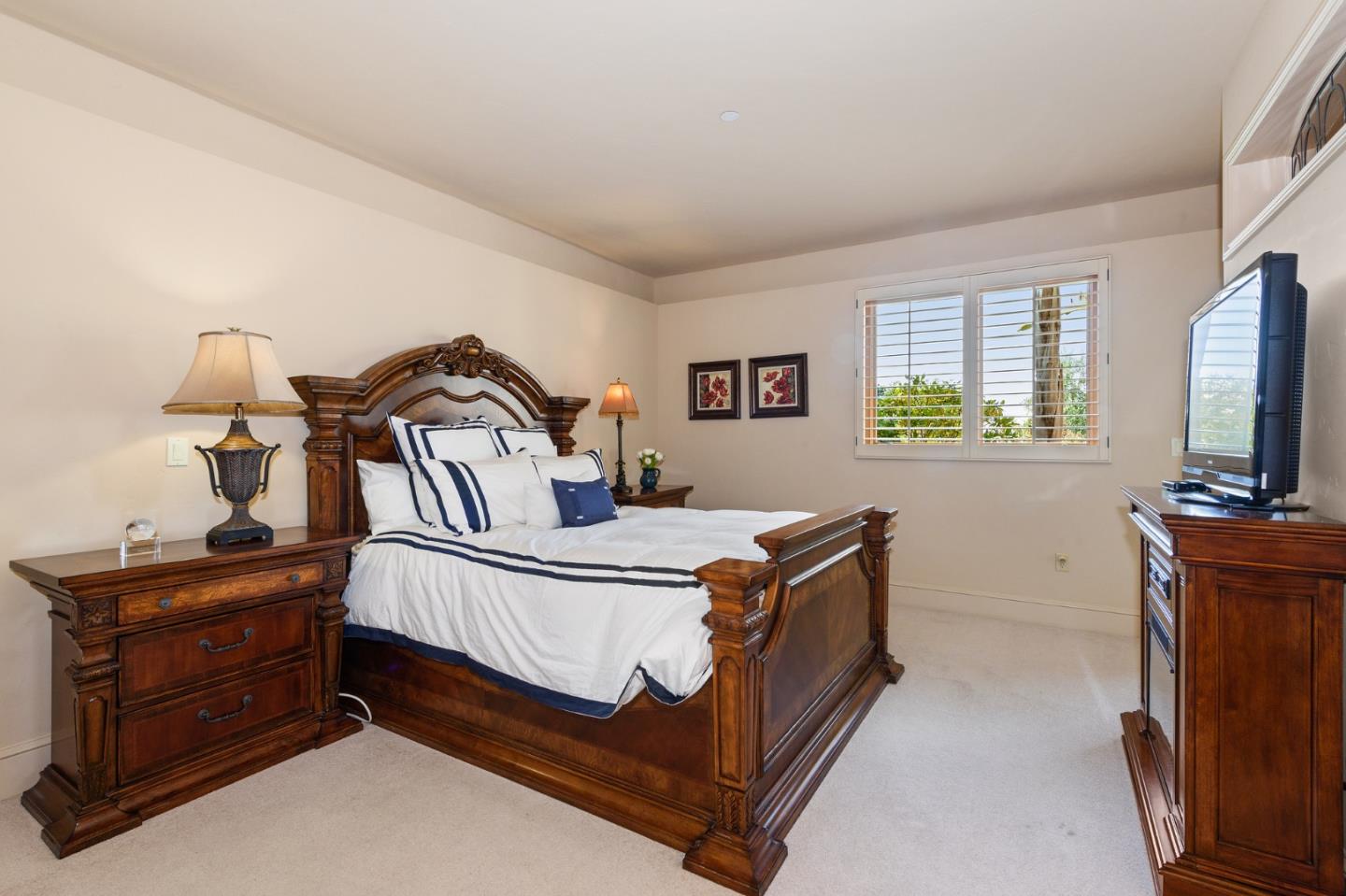 11550 Spur Road Monterey, CA 93940 - Photo 57 of 66 a bedroom with a bed and a flat tv screen on dresser