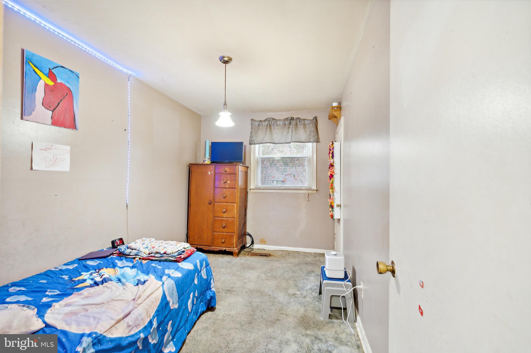 1719 Griffith Street Philadelphia, PA 19111 - Photo 13 of 31 a bedroom with a bed and cabinets