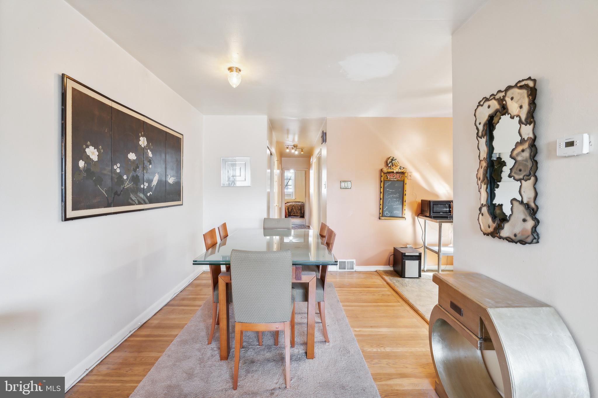 1719 Griffith Street Philadelphia, PA 19111 - Photo 19 of 31 a dining room with wooden floor and large windows