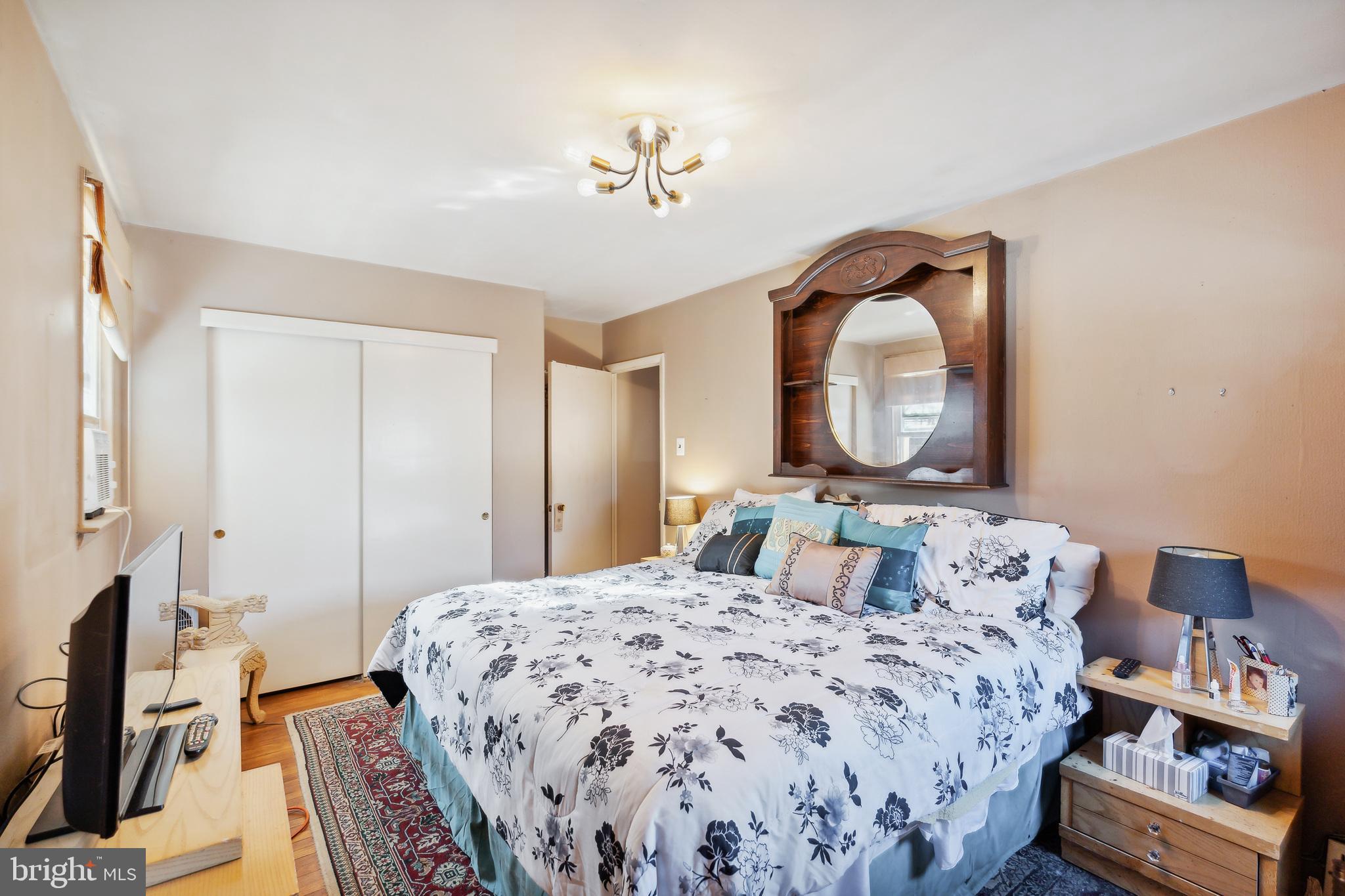 1719 Griffith Street Philadelphia, PA 19111 - Photo 22 of 31 a bedroom with a bed and a mirror on dresser