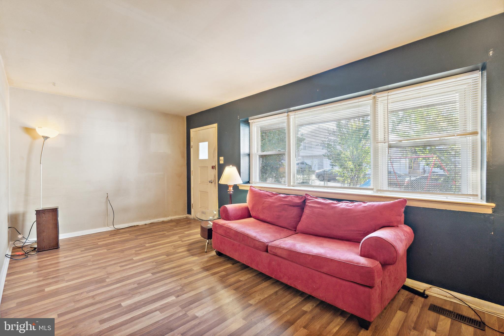 1719 Griffith Street Philadelphia, PA 19111 - Photo 3 of 31 a living room with furniture and a large window