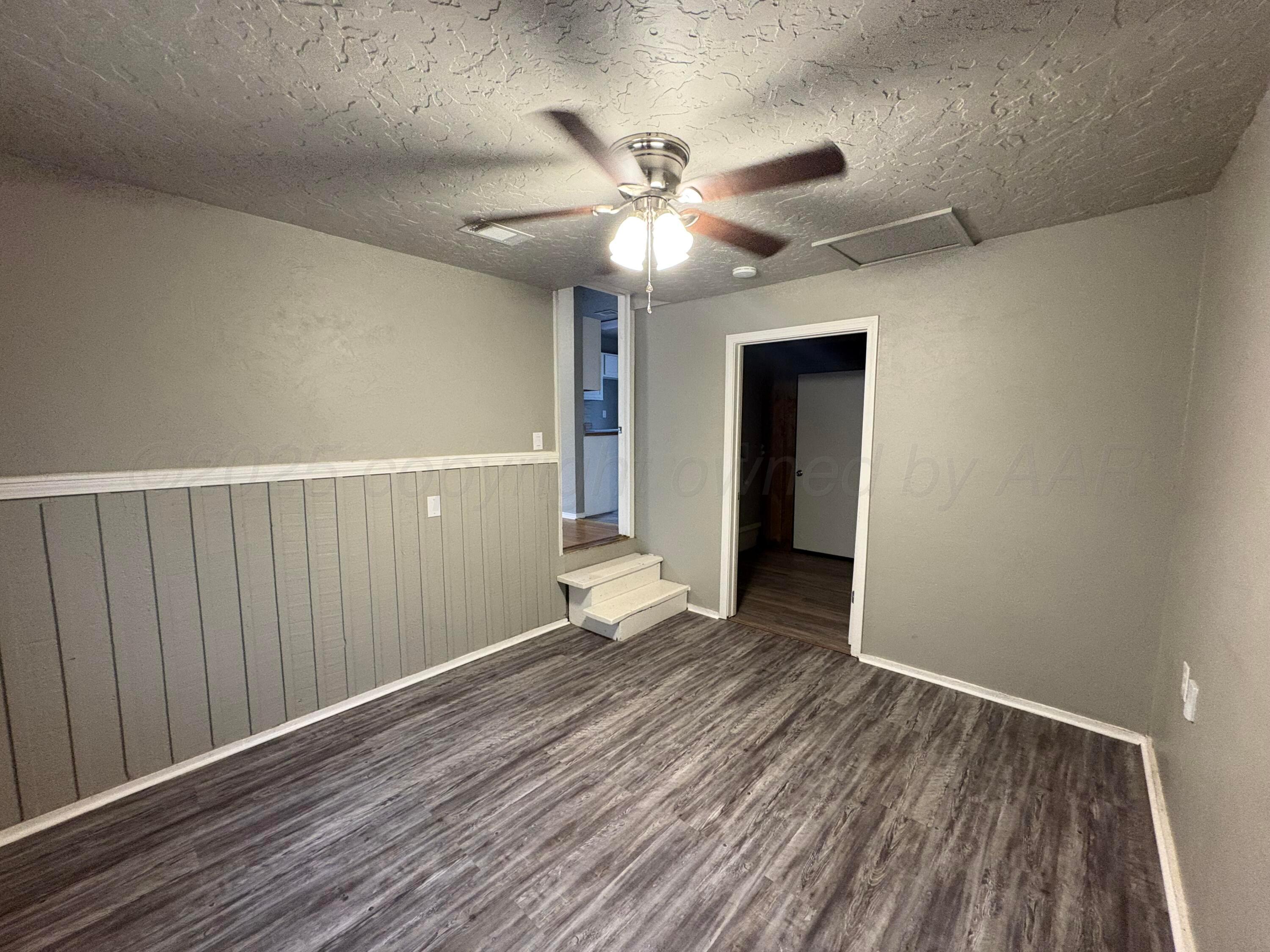 4514 South Bonham Street Amarillo, TX 79110 - Photo 4 of 10 wooden floor in an empty room