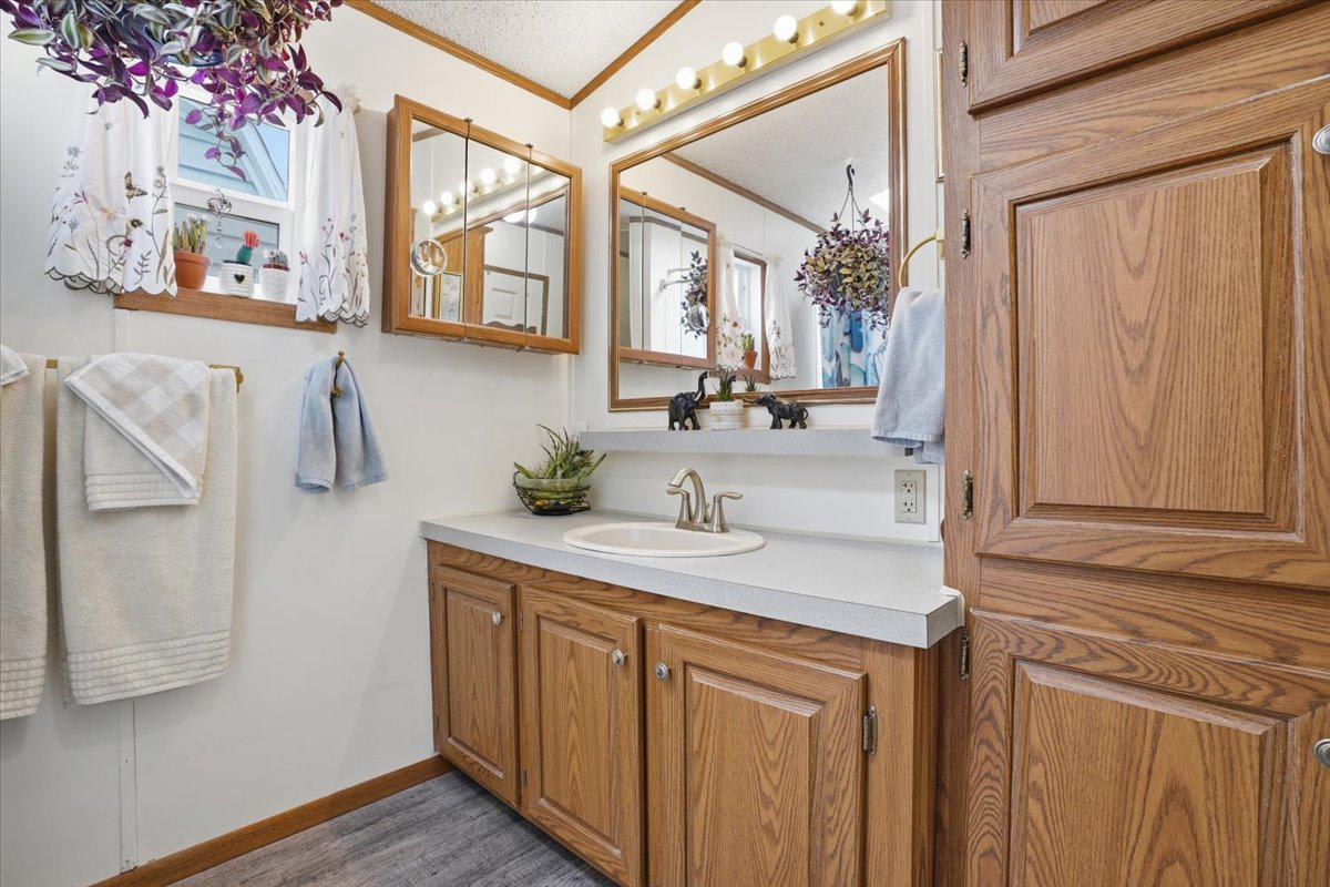3350 Airport Road, Unit 5 Allentown, PA 18109 - Photo 27 of 53 Charming bathroom with warm wood accents.