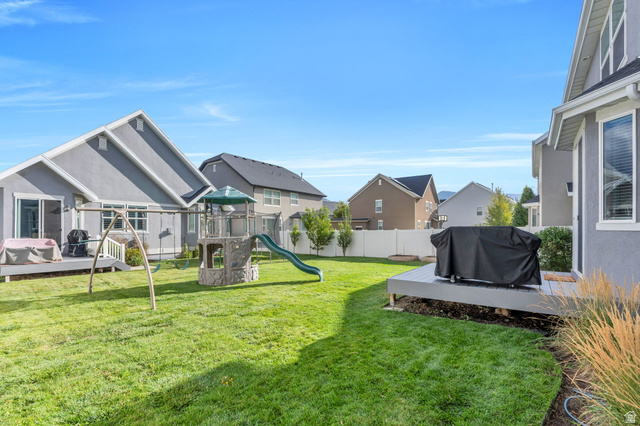 2194 Autumn Drive Mapleton, UT 84664 - Photo 28 of 41 Expansive grassy yard with two distinct outdoor decks and a white privacy fence