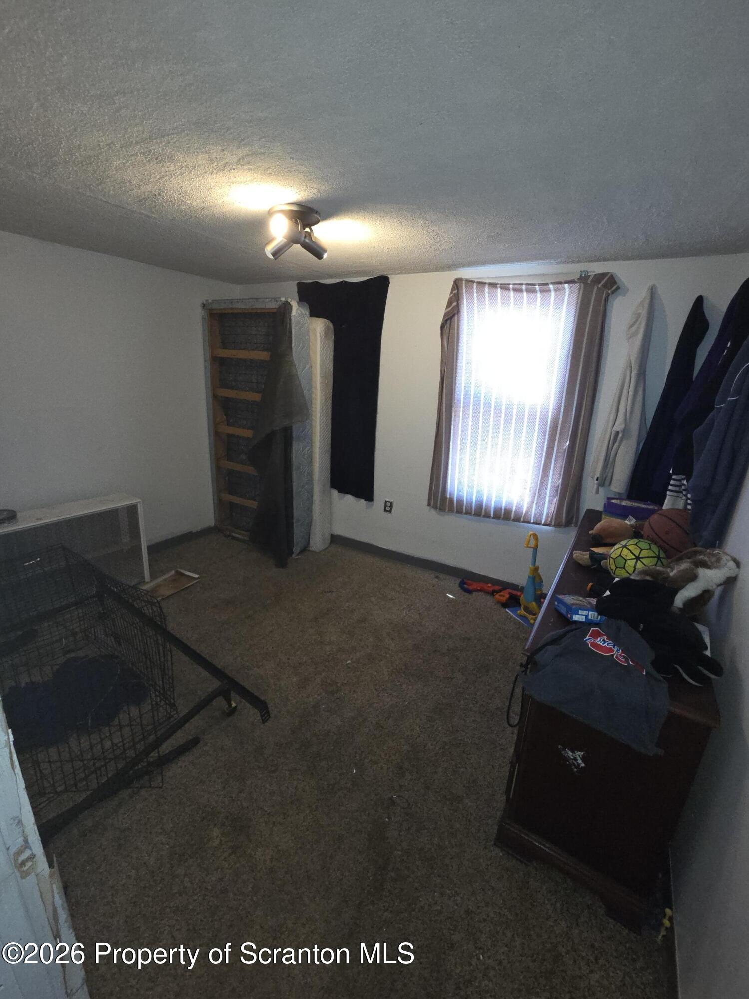 816 Capouse Avenue Scranton, PA 18509 - Photo 5 of 10 a view of an empty room