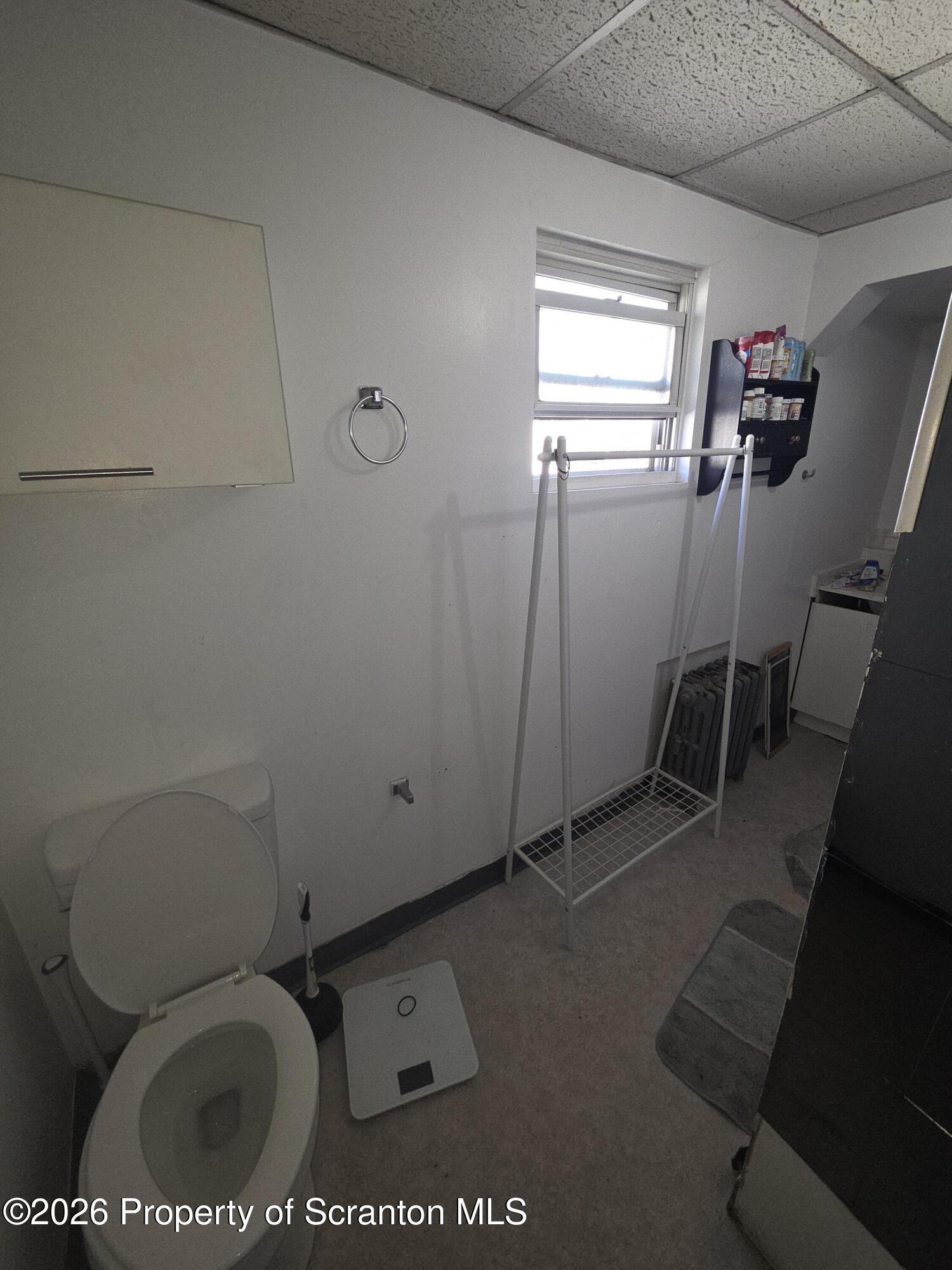 816 Capouse Avenue Scranton, PA 18509 - Photo 7 of 10 a bathroom with a toilet and a sink