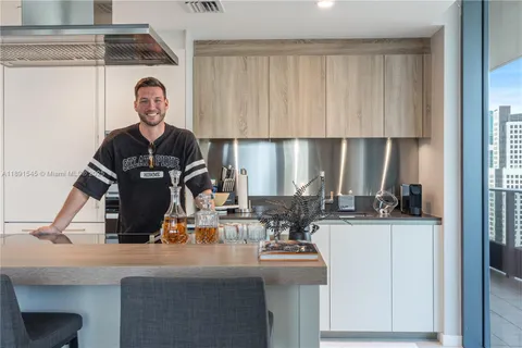 a view of living room with a sink and chandelier