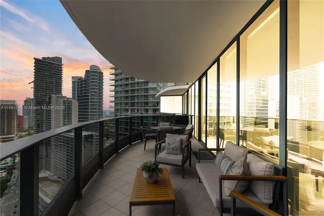 a view of a balcony with chairs