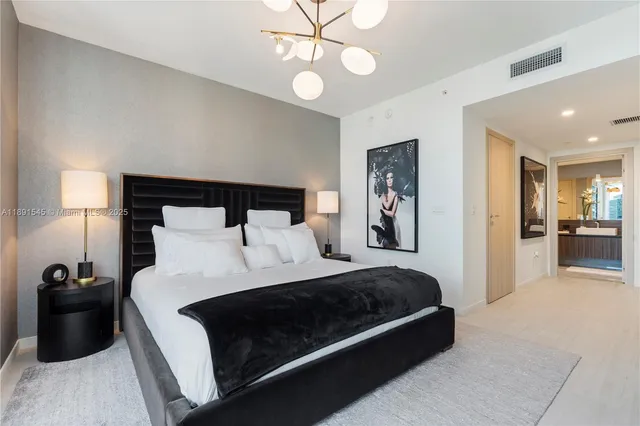 a bedroom with a bed and walk in closet