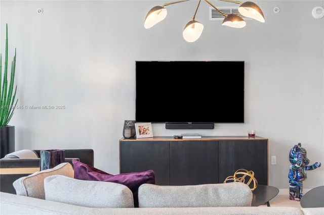 a living room with a couch and a flat screen tv