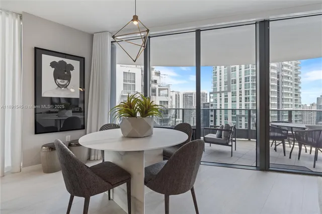 a dining room with furniture and window