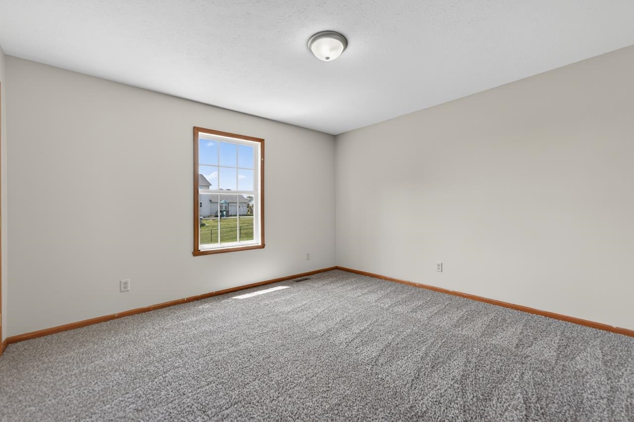 676 Elberon Way Roscoe, IL 61073 - Photo 25 of 30 an empty room with a window