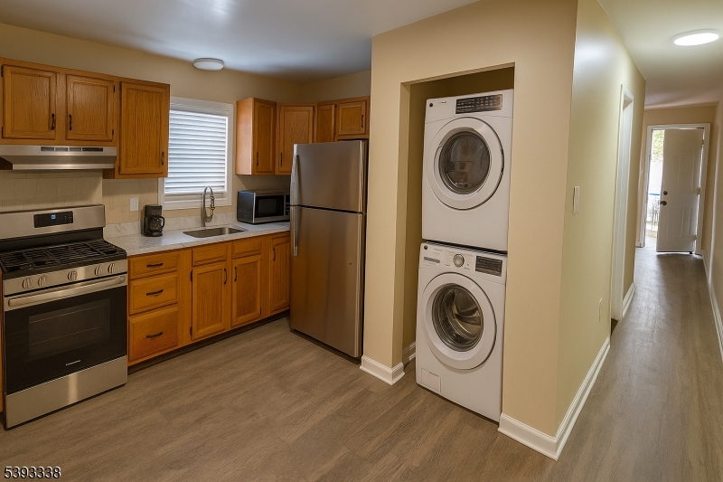 a kitchen with a washer and dryer in it