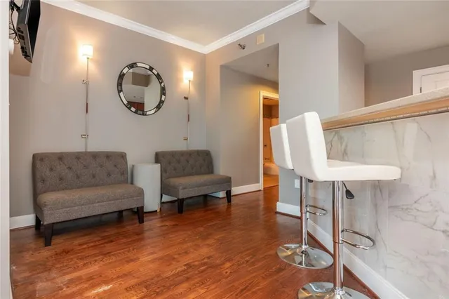 a living room with fireplace furniture and a wooden floor