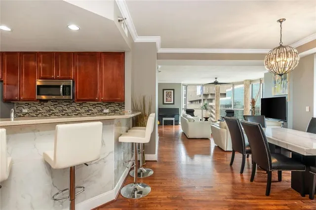 a view of living room kitchen and dining room