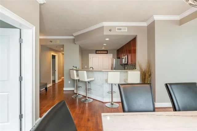 a view of living room with furniture and a flat screen tv