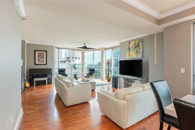 a living room with fireplace furniture and a flat screen tv